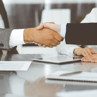 Handshake between two people.