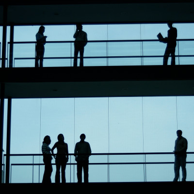 People standing in hallway in office.