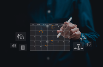 man standing at calendar with pen